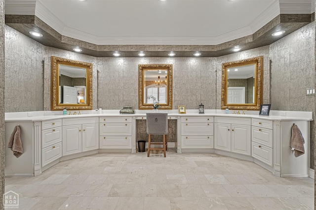 full bathroom with ornamental molding and two vanities