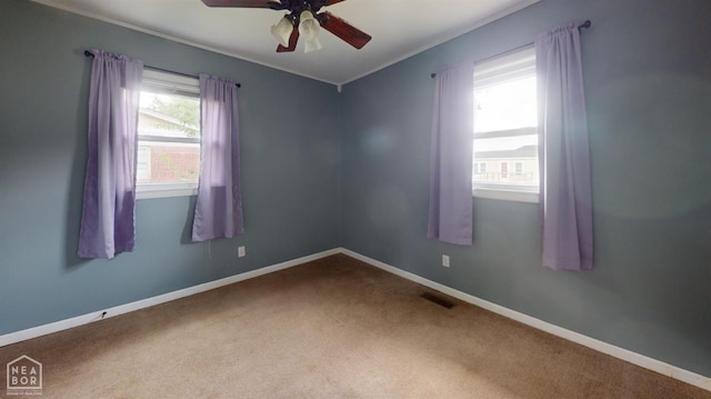 207 11th St, Marked Tree, AR 72365 - spare room featuring carpet flooring, a ceiling fan, and ornamental molding
