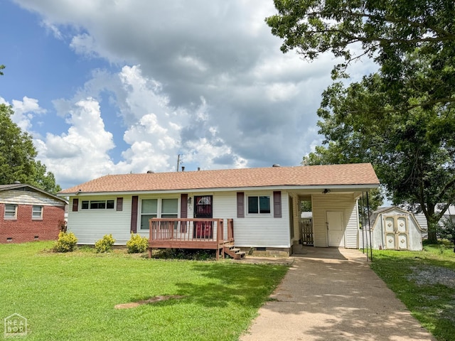 207 11th St, Marked Tree, AR 72365 - ranch-style home featuring crawl space, a storage shed, concrete driveway, a front yard, and an attached carport