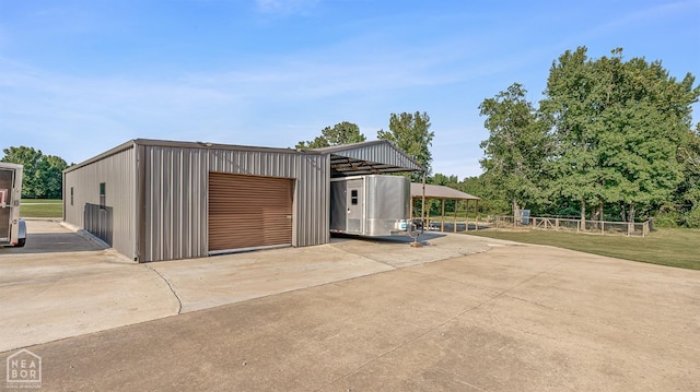 garage with driveway and a garage