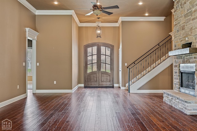 719 Smithfield Dr, Jonesboro, AR 72401 - foyer entrance with a fireplace, french doors, hardwood / wood-style flooring, a ceiling fan, and ornamental molding