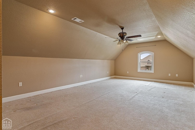 719 Smithfield Dr, Jonesboro, AR 72401 - additional living space featuring lofted ceiling, light carpet, baseboards, a textured ceiling, and a ceiling fan