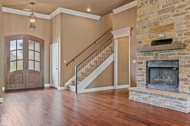719 Smithfield Dr, Jonesboro, AR 72401 - entrance foyer with french doors, stairway, ornamental molding, baseboards, and wood finished floors
