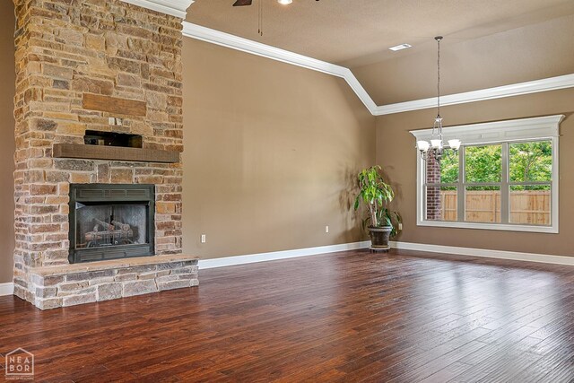 719 Smithfield Dr, Jonesboro, AR 72401 - unfurnished living room featuring ornamental molding, vaulted ceiling, baseboards, wood-type flooring, and a chandelier