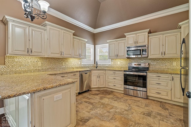 719 Smithfield Dr, Jonesboro, AR 72401 - kitchen featuring appliances with stainless steel finishes, a sink, a peninsula, tasteful backsplash, and a towering ceiling