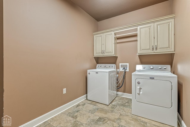 719 Smithfield Dr, Jonesboro, AR 72401 - laundry area featuring cabinet space, washer and dryer, baseboards, and light stone finish floors
