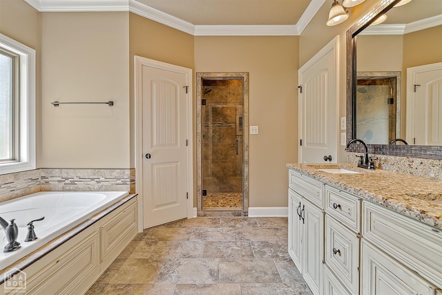 719 Smithfield Dr, Jonesboro, AR 72401 - bathroom featuring a shower stall, crown molding, a garden tub, vanity, and stone finish floors