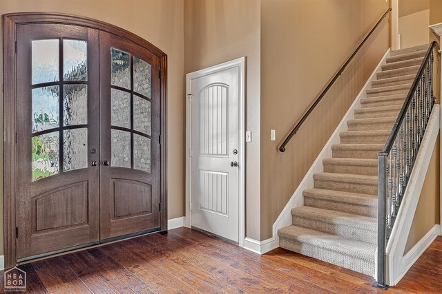 719 Smithfield Dr, Jonesboro, AR 72401 - entryway with wood finished floors, stairs, and baseboards
