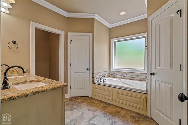 719 Smithfield Dr, Jonesboro, AR 72401 - full bathroom featuring ornamental molding, a garden tub, recessed lighting, stone finish floors, and double vanity