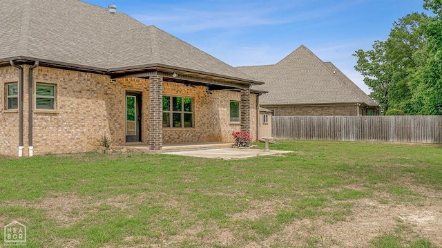 719 Smithfield Dr, Jonesboro, AR 72401 - rear view of property featuring a patio, brick siding, ceiling fan, and roof with shingles