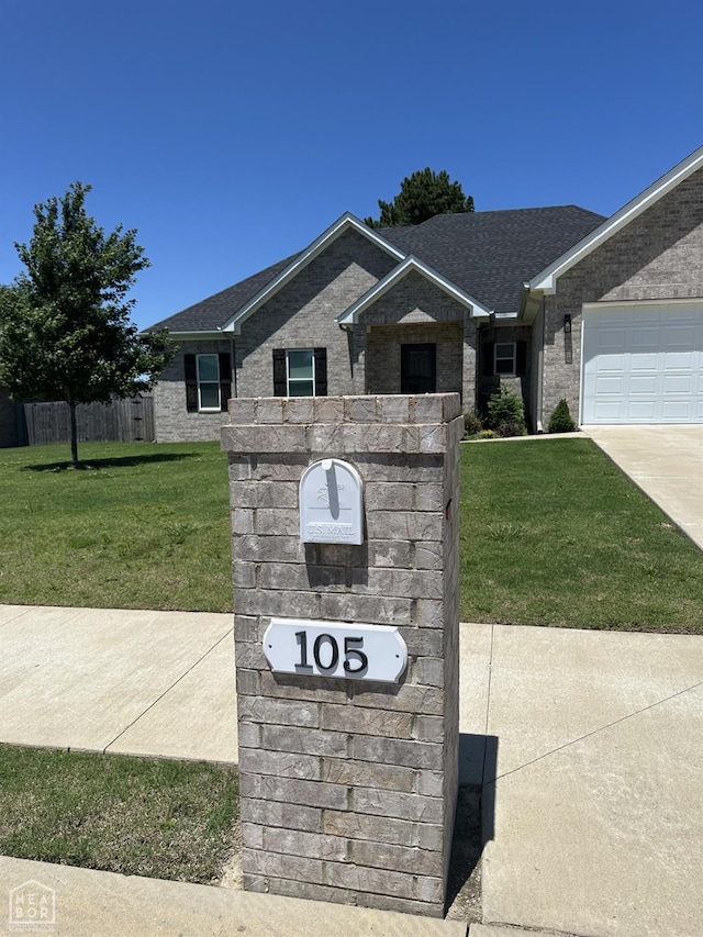 105 Brayden Ln, Brookland, AR 72417 - exterior view of brick siding, driveway, and a shingled roof
