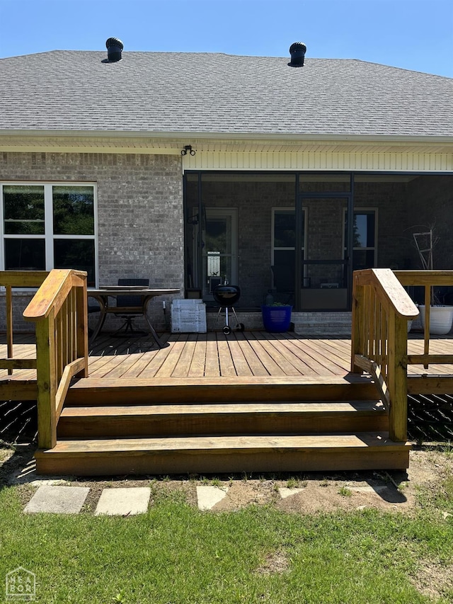 105 Brayden Ln, Brookland, AR 72417 - wooden deck with a sunroom