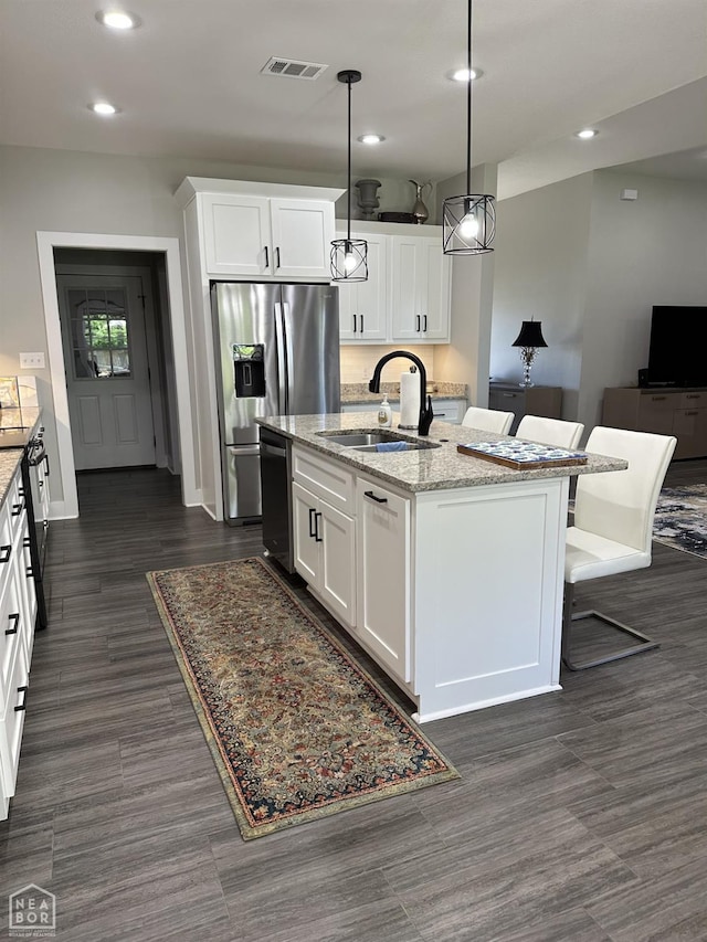 105 Brayden Ln, Brookland, AR 72417 - kitchen with a sink, appliances with stainless steel finishes, recessed lighting, an island with sink, and white cabinets