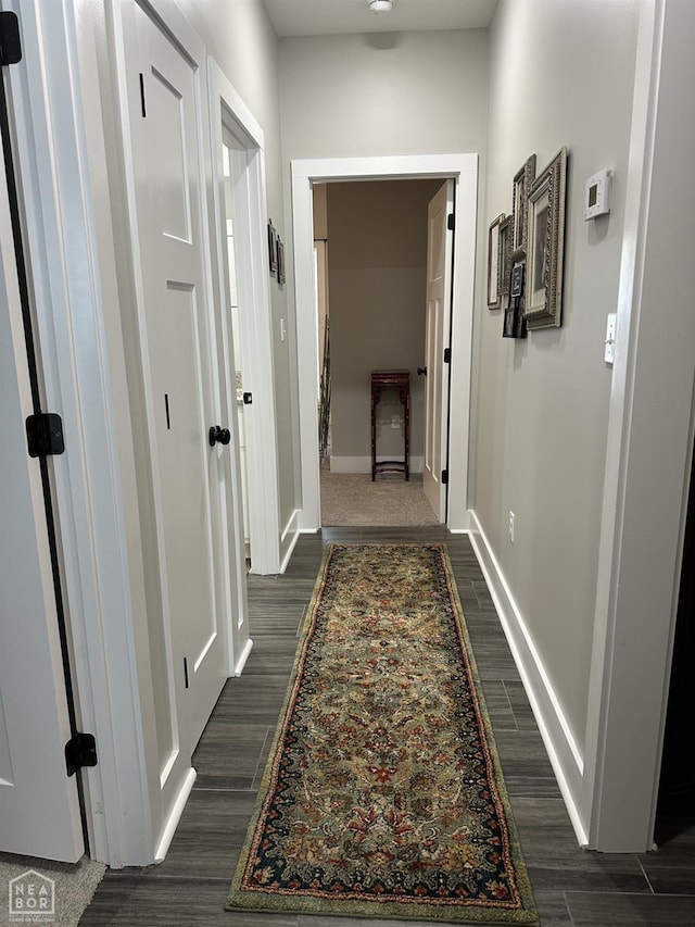 105 Brayden Ln, Brookland, AR 72417 - corridor featuring dark wood-type flooring and baseboards