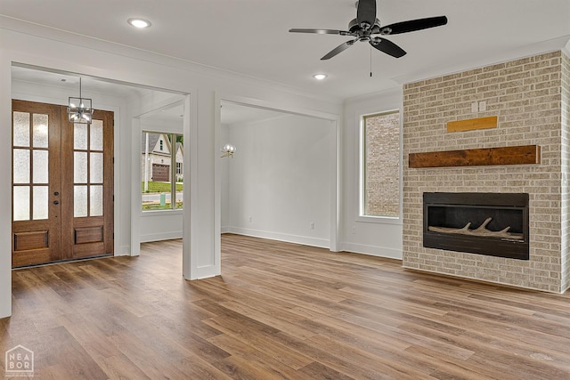 3425 Hudson Ct, Jonesboro, AR 72405 - unfurnished living room featuring wood finished floors, ornamental molding, baseboards, french doors, and ceiling fan