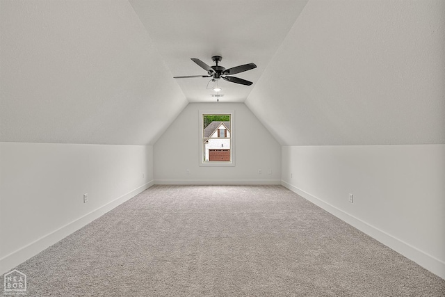 3425 Hudson Ct, Jonesboro, AR 72405 - additional living space with light carpet, a ceiling fan, vaulted ceiling, and baseboards