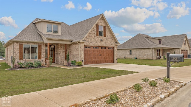 3425 Hudson Ct, Jonesboro, AR 72405 - view of front facade with brick siding, an attached garage, driveway, a front yard, and roof with shingles