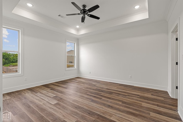 3425 Hudson Ct, Jonesboro, AR 72405 - spare room featuring ornamental molding, a raised ceiling, a ceiling fan, dark wood finished floors, and baseboards
