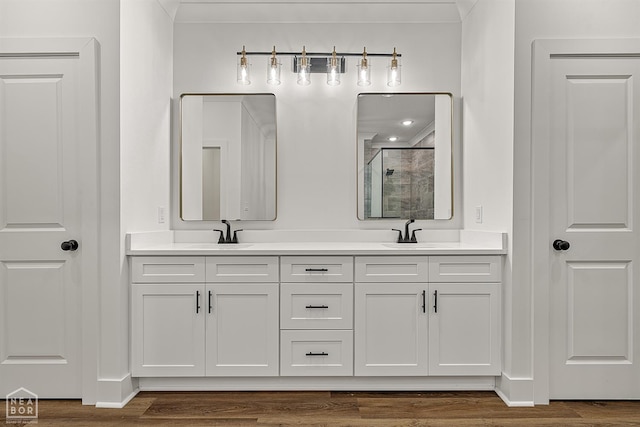 3425 Hudson Ct, Jonesboro, AR 72405 - full bath featuring a shower stall, double vanity, and wood finished floors