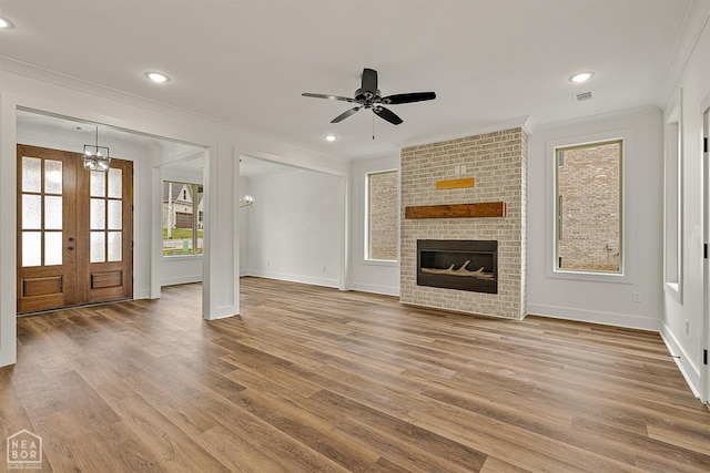 3425 Hudson Ct, Jonesboro, AR 72405 - unfurnished living room with crown molding, wood finished floors, baseboards, ceiling fan, and recessed lighting