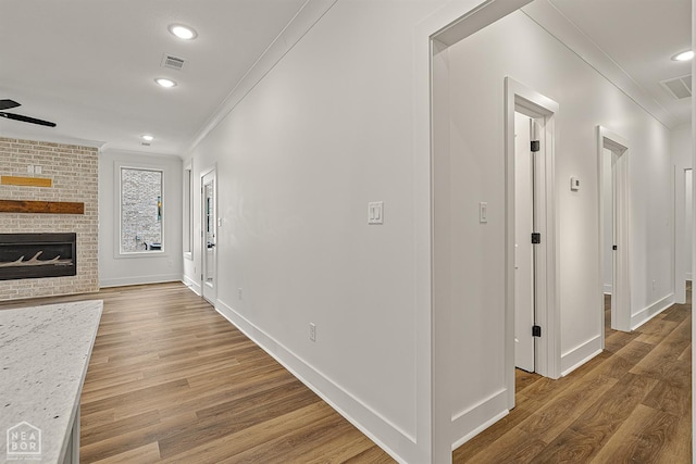 3425 Hudson Ct, Jonesboro, AR 72405 - corridor with crown molding, recessed lighting, wood finished floors, and baseboards