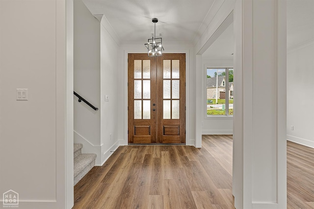 3425 Hudson Ct, Jonesboro, AR 72405 - foyer entrance with crown molding, french doors, wood finished floors, baseboards, and stairs