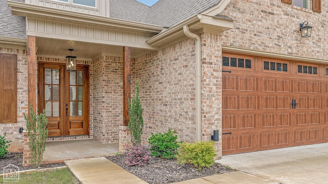 3425 Hudson Ct, Jonesboro, AR 72405 - entrance to property with a shingled roof, brick siding, french doors, and a garage