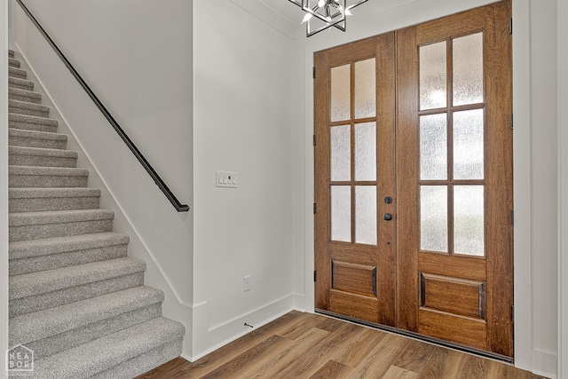 3425 Hudson Ct, Jonesboro, AR 72405 - entryway with french doors, wood finished floors, stairway, baseboards, and a chandelier