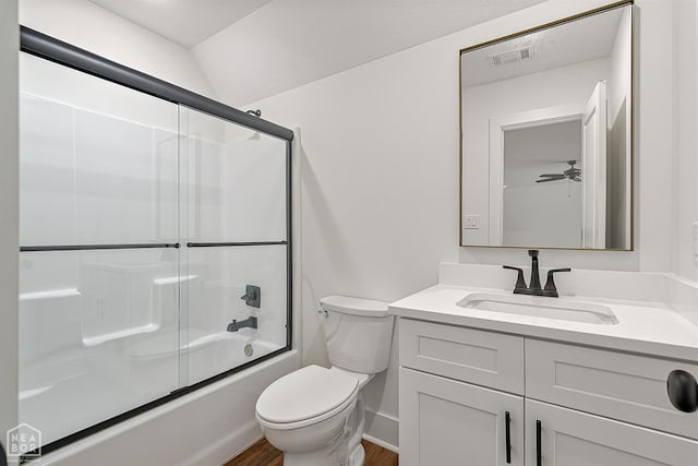 3425 Hudson Ct, Jonesboro, AR 72405 - bathroom featuring vanity, toilet, bath / shower combo with glass door, wood finished floors, and baseboards
