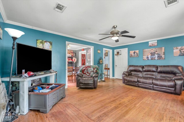 316 SE 2nd St SE, Walnut Ridge, AR 72476 - living area with a ceiling fan, wood-type flooring, and crown molding