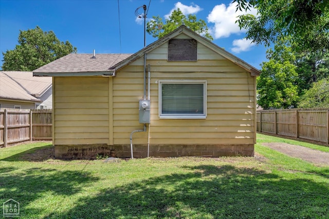316 SE 2nd St SE, Walnut Ridge, AR 72476 - rear view of house with a fenced backyard and a shingled roof