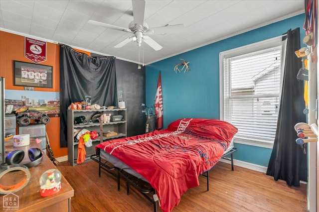 316 SE 2nd St SE, Walnut Ridge, AR 72476 - bedroom featuring wood-type flooring, crown molding, and a ceiling fan