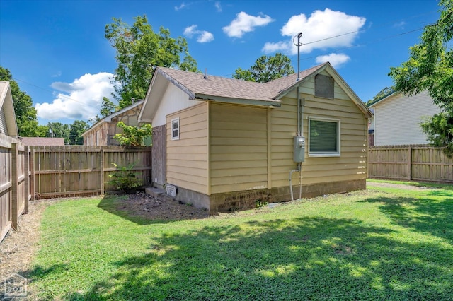316 SE 2nd St SE, Walnut Ridge, AR 72476 - view of home's exterior with a fenced backyard and a shingled roof