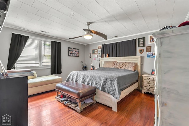 316 SE 2nd St SE, Walnut Ridge, AR 72476 - bedroom featuring crown molding, wood finished floors, and ceiling fan