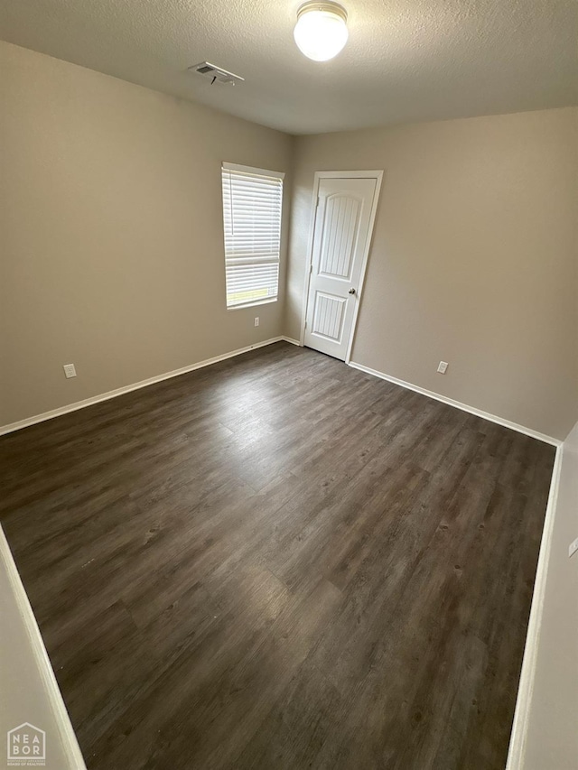 3726 Glitterman Dr, Jonesboro, AR 72404 - empty room with dark wood-type flooring and baseboards