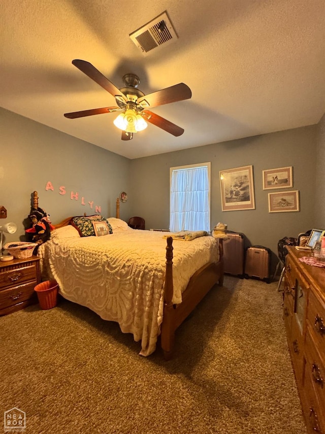 carpeted bedroom with a ceiling fan, a textured ceiling, and visible vents