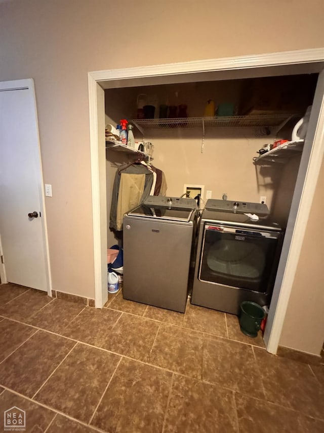laundry area featuring separate washer and dryer, tile patterned flooring, and laundry area