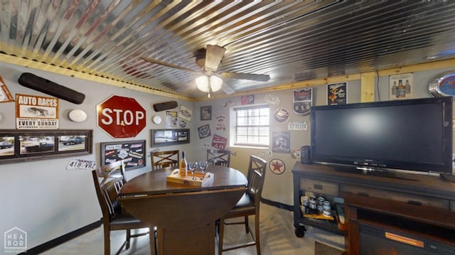 dining room featuring ceiling fan and baseboards