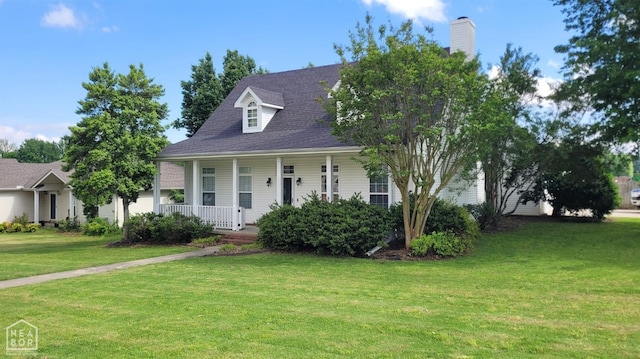 view of front of home with covered porch and a front yard