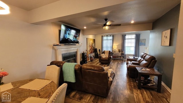 living area with a fireplace, a ceiling fan, recessed lighting, and wood finished floors