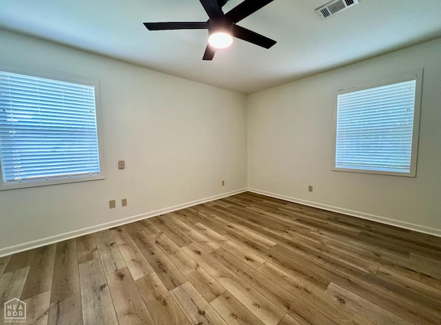 104 N Hunter Ln N, Jonesboro, AR 72405 - unfurnished room with hardwood / wood-style floors, a ceiling fan, and baseboards