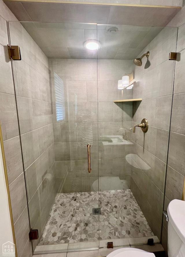 104 N Hunter Ln N, Jonesboro, AR 72405 - bathroom with toilet, a shower stall, and tile patterned floors