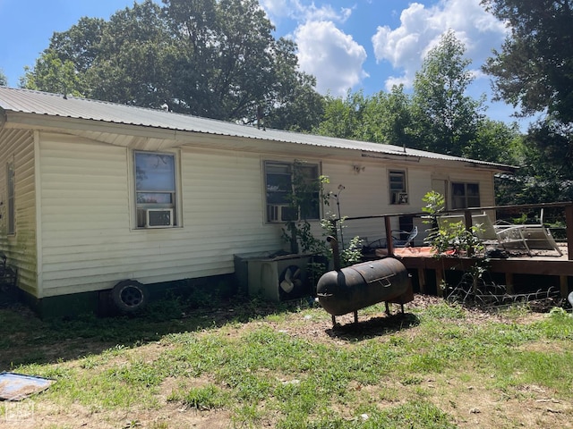 1701 Duncan Rd, Jonesboro, AR 72401 - back of house featuring a deck and a metal roof