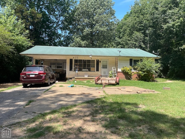 1701 Duncan Rd, Jonesboro, AR 72401 - single story home featuring a porch, driveway, a front yard, and a metal roof