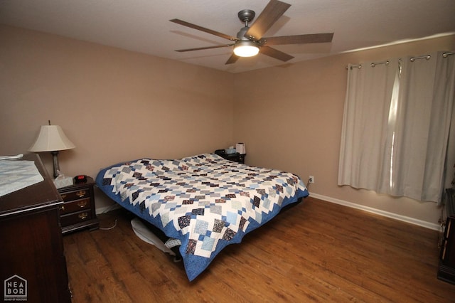 bedroom featuring dark wood-style flooring, baseboards, and ceiling fan