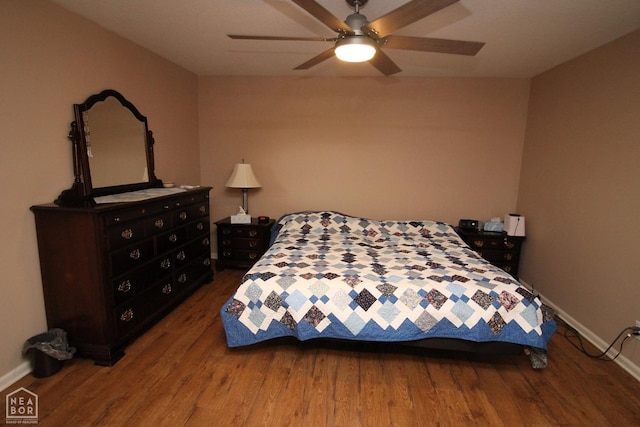 bedroom featuring baseboards, ceiling fan, and wood finished floors