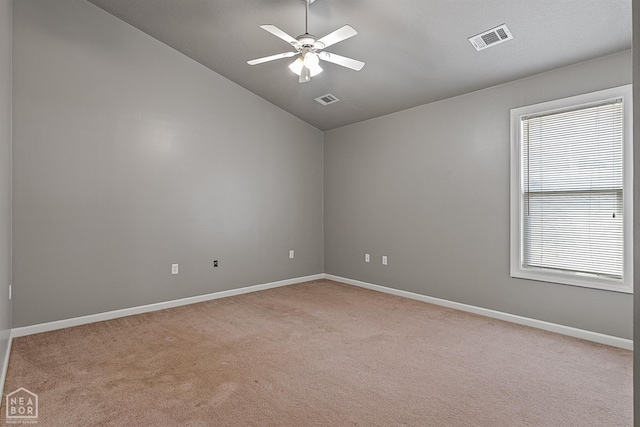 2101 Belleview Cv, Jonesboro, AR 72404 - empty room with visible vents, ceiling fan, light carpet, and lofted ceiling