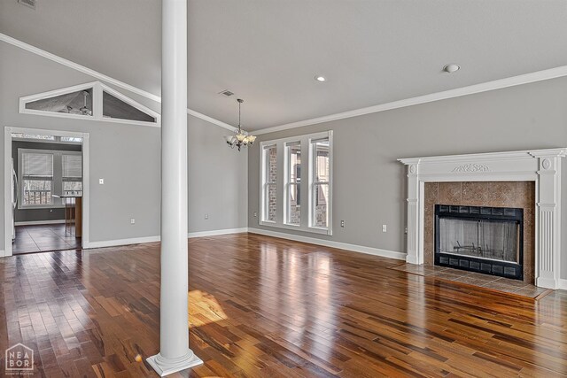 2101 Belleview Cv, Jonesboro, AR 72404 - unfurnished living room featuring ornamental molding, decorative columns, and plenty of natural light
