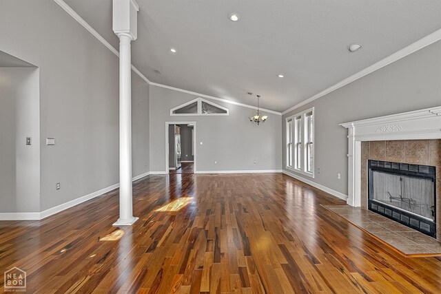 2101 Belleview Cv, Jonesboro, AR 72404 - unfurnished living room with decorative columns, a fireplace, baseboards, and crown molding