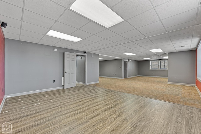 2101 Belleview Cv, Jonesboro, AR 72404 - below grade area featuring wood finished floors, baseboards, and a drop ceiling